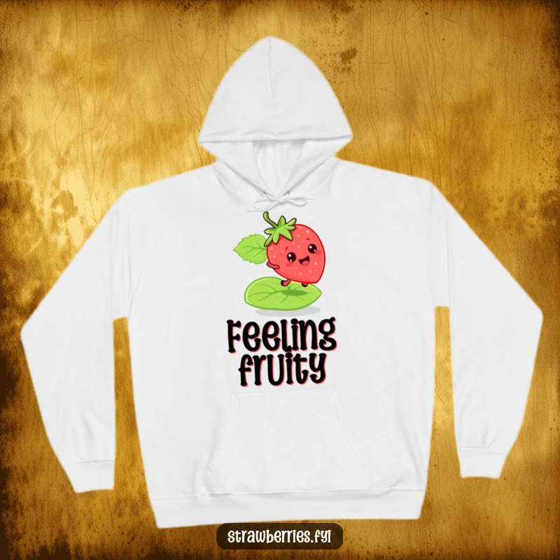 Funny bouncy strawberry hoodie with a character energetically bouncing on a green leaf, offering cozy warmth and humorous fun.