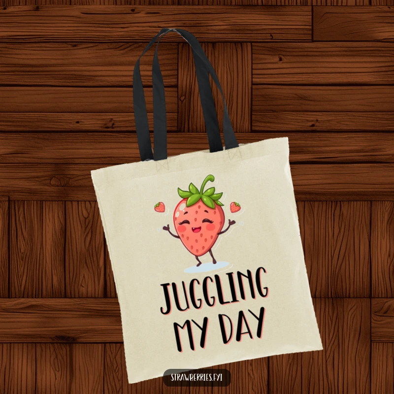 Funny tote bag showcasing a giggling anthropomorphic strawberry juggling leaves, ideal for carrying everyday items.